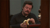ron_swanson_trying_to_eat_a_banana-43461.gif